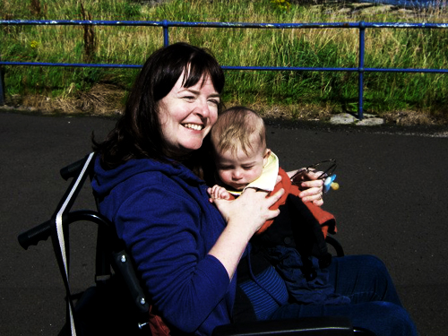 Laura with son Jonathan on her lap 