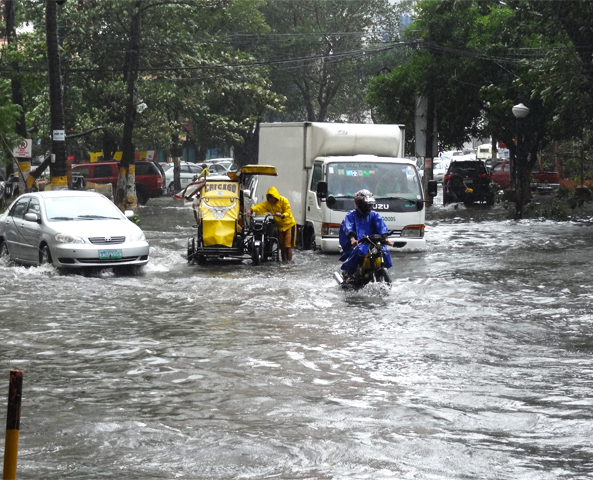 vehicles left at a standstill in the flooding