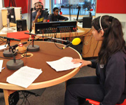 Sahar takes direction before recording