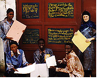 May and Amet outside the papermill in Gambia