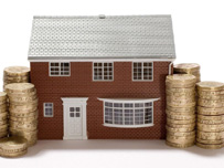 Model of house and coins