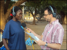 Trainee Lillian Ochoo preparing to contribute to a programme in Sudan alongside BBC World Service journalist Damian Zane