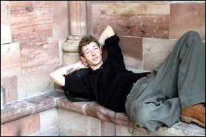 Russell Smith sleeping in a church doorway