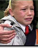 Schoolgirl crying during Holy Cross conflict