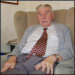 Derek Scott sat in his living room