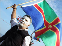 Performer holding a Lincolnshire Flag