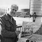 Jim Leckey, pictured in a newspaper with one of his many paintings, this one of Belfast Gasometers, now gone.