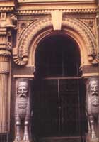 Arched doorway flanked by carved guardians representing the Prophet Zoroaster