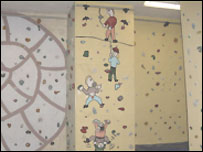 People on an indoor climbing wall