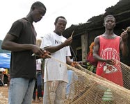 Fishermen mending their nets