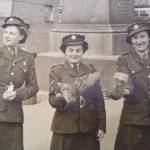 Hilda and friends from the 93rd Search Light Regiment feeding the pigeons.
