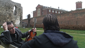John Hegley with a project participant outside HM Prison Reading
