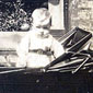 Baby Jim in his pram at the back of their house in East Belfast