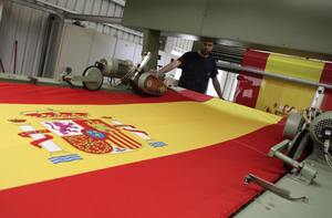 This factory near Madrid has churned out 50,000 flags for Spain fans - REUTERS/Juan Medina