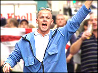 Crowds walking to a football match