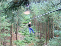 Lisa on the 200 foot zip wire above the trees