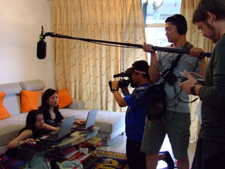 Filming the blogger in her flat.