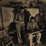 Capt T.L. Ward, Air Liaison Officer on left advises Group Captain Lewis, commanding Bomber Wing Forward Headquarters Desert Airforce on targets as part of MORU operation at El Alamein