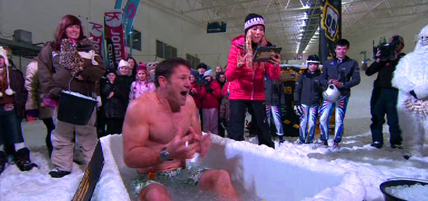Steve Backshall in an ice bath being asked wildlife questions by Naomi Wilkinson