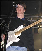 Alex on stage at The Plug