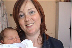 Sarah Linton holding her new baby