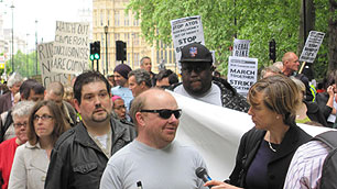 Marchers on the Hardest Hit march near the Houses of Parliament in central London