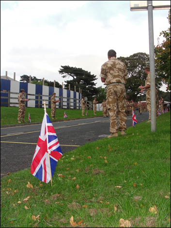 Troops lining a road