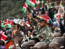 A young boy reacts as Kenyans watch the signing of the new constitution into law, at Uhuru Park in Nairobi, Kenya, Friday, Aug. 27, 2010.