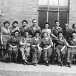 Workers at Royal Ordnance Factory No.11, Newport in 1944. Glenyss is sitting third from left (looking at picture).