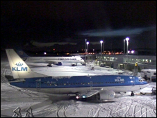 View of aircraft covered in snow at gates at 06:00hrs