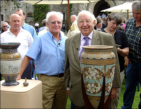 A man shows Henry Sandon his pots