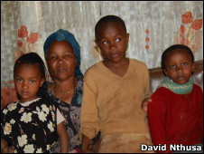 Loise Wathia with her grandchildren. 