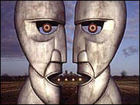 Album cover showing two metal head sculptures