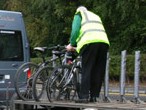 Bike being loaded onto bus