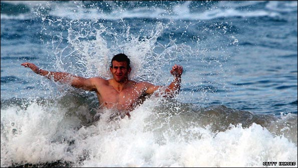 Tom Croft was not in the original squad but has has made the Test XV. Here he relaxes in the sea next to the squad's Durban's hotel