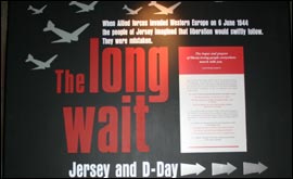 Sign showing aircraft which reads: The Long Wait Jerey and D-Day