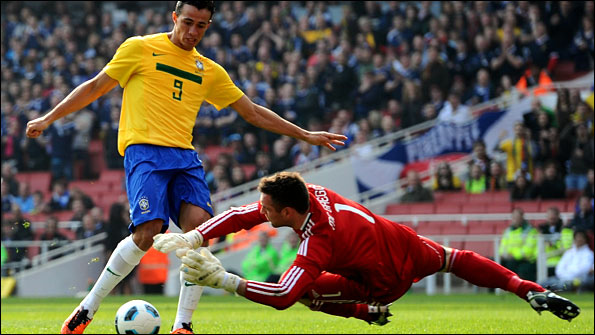 Brazil's Leandro Damiao has an effort stopped by Scotland goalkeeper Allan McGregor of Scotland 