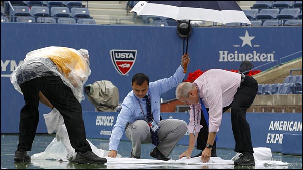 Officials attempt to make the playing surface safe
