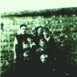 The Griffiths family; front row left Gerald, then Peter, Second row left; Chris then Sheila, Third Row, left David, then Graham. Back row, Morgan and Marie. Photograph taken before they were bombed, the family is stood in front of the brick built Air Raid shelter, in Sunnydene, Brislington, that saved their lives on that fateful day of 26th April 1942.
