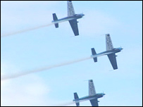 three display planes flying in formation