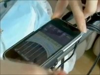 Applegirl playing an iPhone virtual guitar