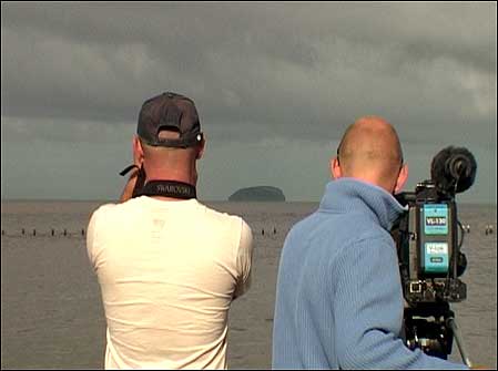 Mike Dilger looks at Steep Holm through binoculars