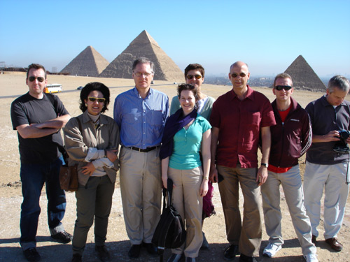 People in front of pyramids