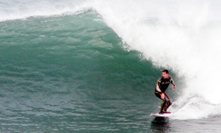 Perfect position. Andy "The Trogg" Hill makes it look easy on a pretty beefy Port wave. Pic Ger Nov 06