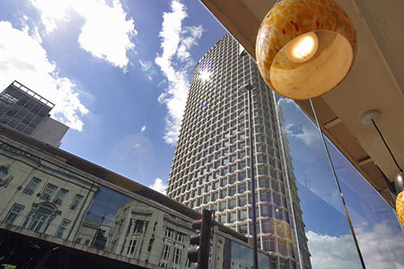 Centre Point seen through a window, photo by Tom Ang