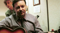 David Brent playing the guitar