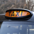 A London black cab with its For Hire light on