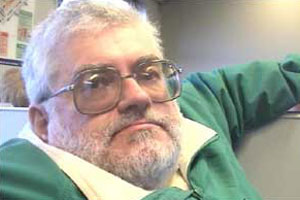 Douglas travels by rail in his wheelchair