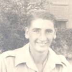 here I am smiling because the war has at last finished in Europe...