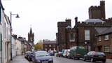 Colour view along High Street, Kirkcudbright, showing the Tolbooth and the County Building.